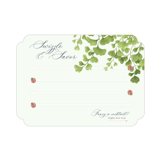 Paper card featuring maidenhair fern watercolor artwork and four acrylic clear swizzle sticks with red ladybugs at the end.